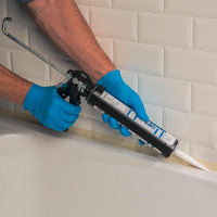 Pistolet pour mastic et perçage joint Dexter, acier noir.